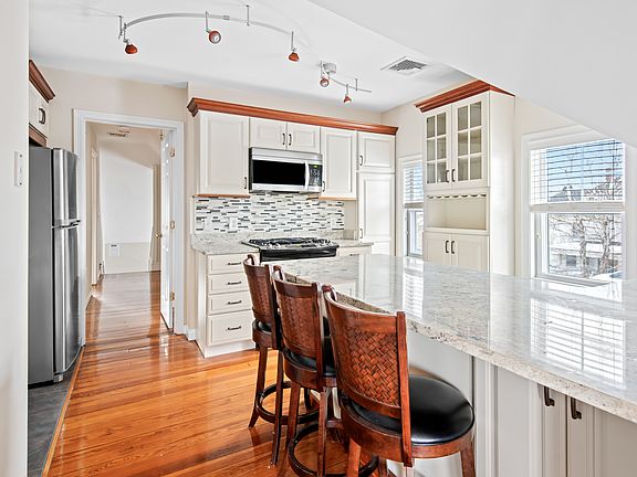 Updated Kitchen with Granite Counters, Stainless Appliances and Ample Storage