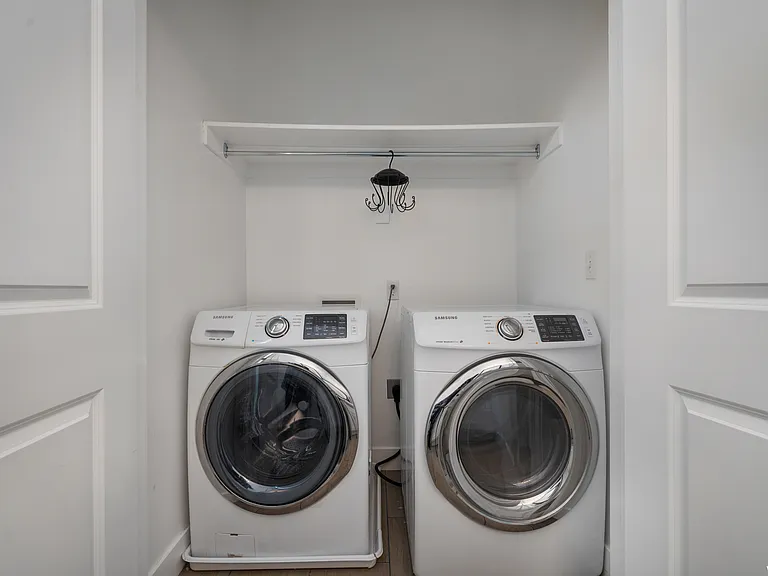 Washer and dryer in the half bathroom on main level.