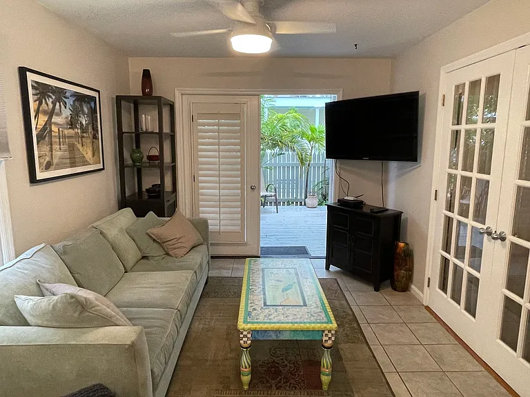 living room accessing the patio