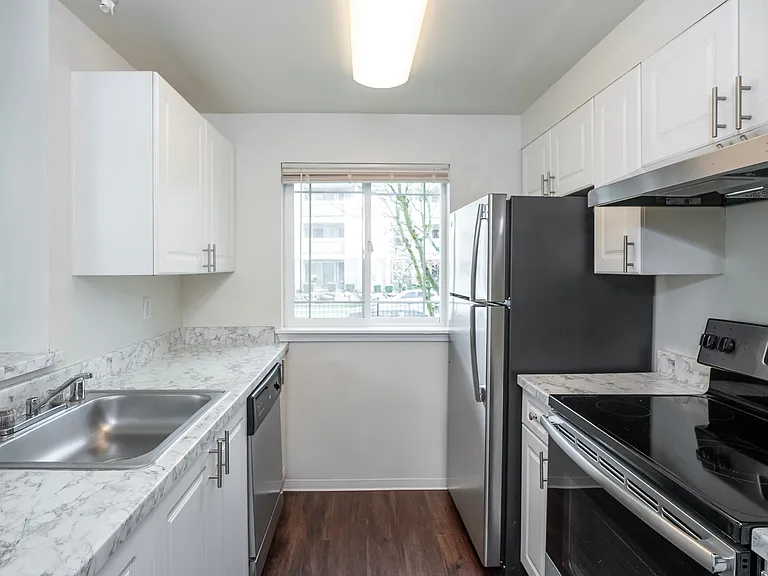 Stylish kitchens with stainless steel appliances and modern finishes.