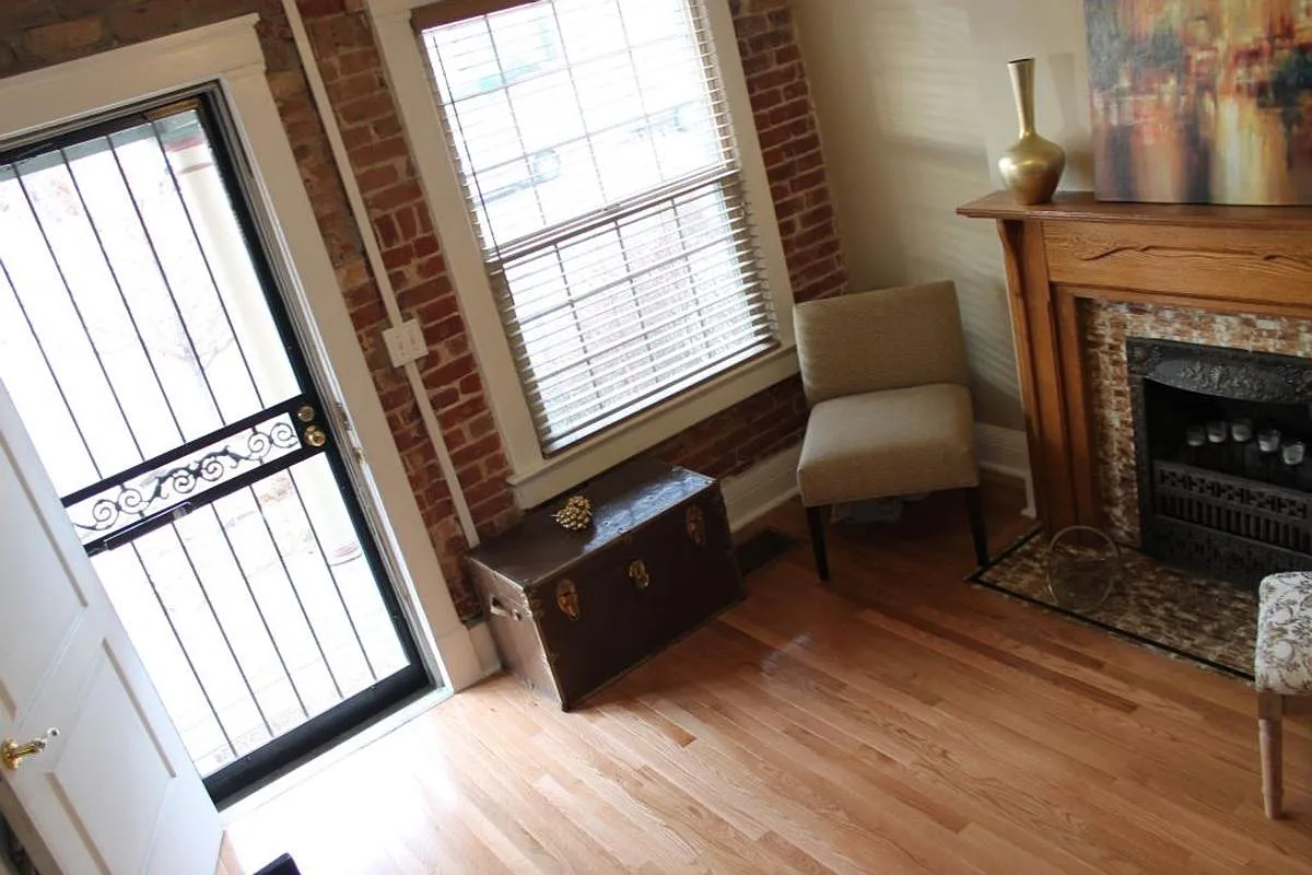 Original fireplace and turn of the century craftsmanship. Hardwood floors throughout living spaces. - 2838 Irving St