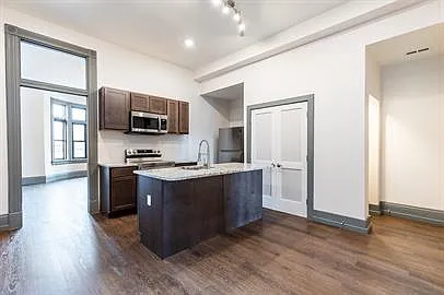 Solid wood cabinets, stainless appliances including dishwasher and microwave, lots of storage.