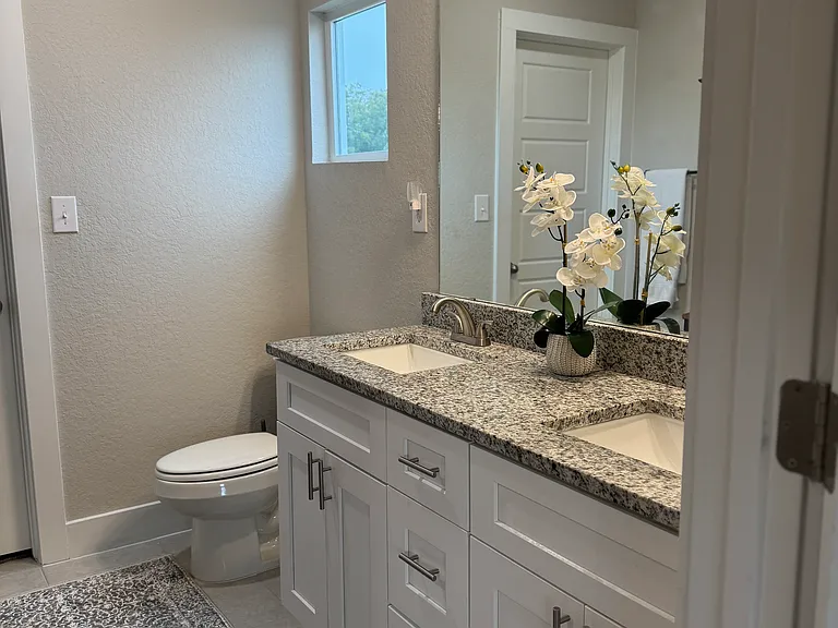 Master Bathroom features dual vanity and walk-in shower.