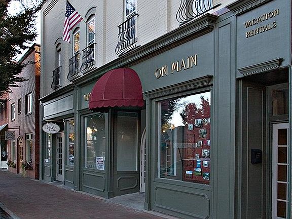 Exterior of building. Ground floor is retail including restaurant and salon.