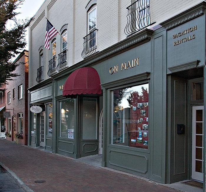 Exterior of building. Ground floor is retail including restaurant and salon.