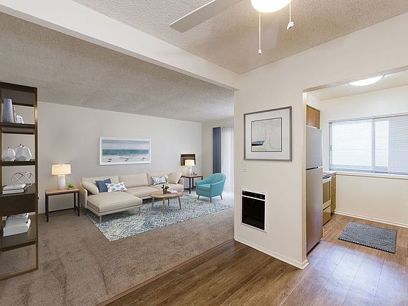Renovated I kitchen and dining area with hard surface flooring and carpeted living area