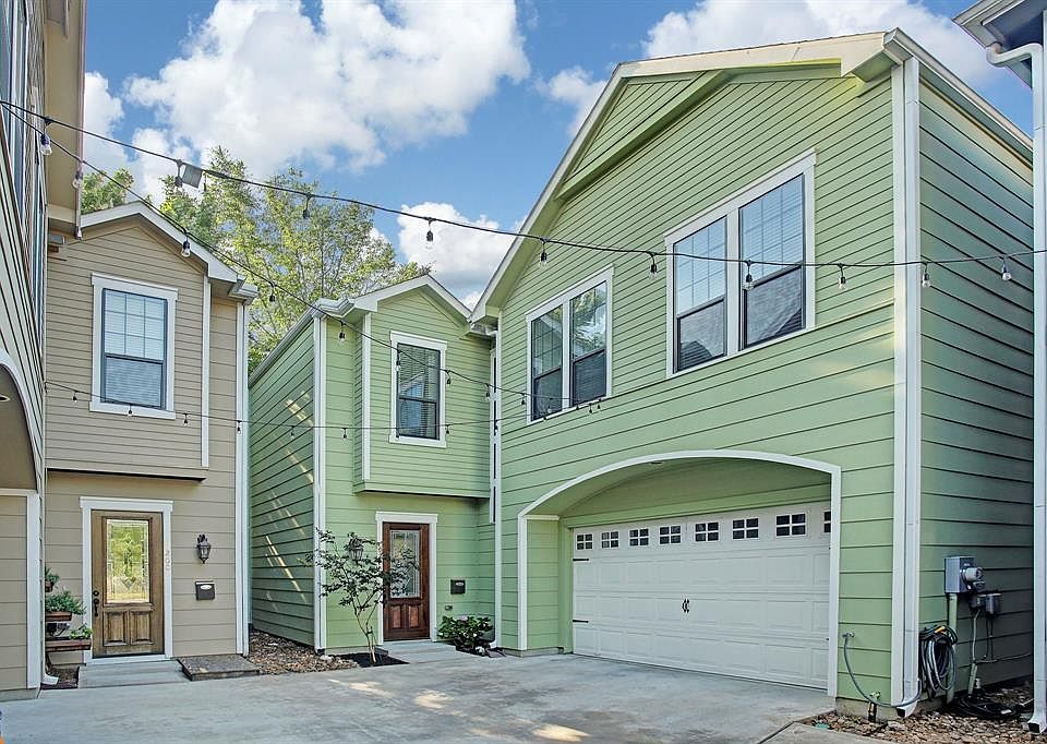 This free standing home in The Heights has first floor open-concept living/dining with lots of windows across the back for an ab