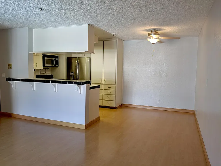 Dining room next to kitchen and living room