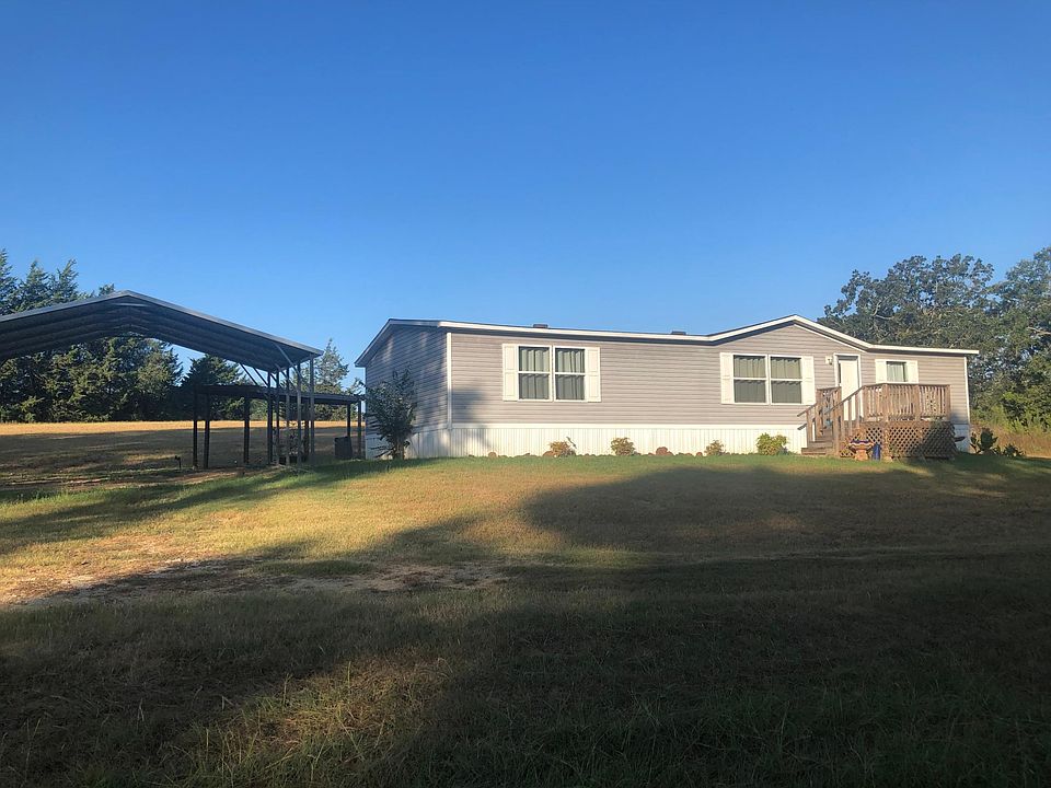 Front of main home with carport on the side