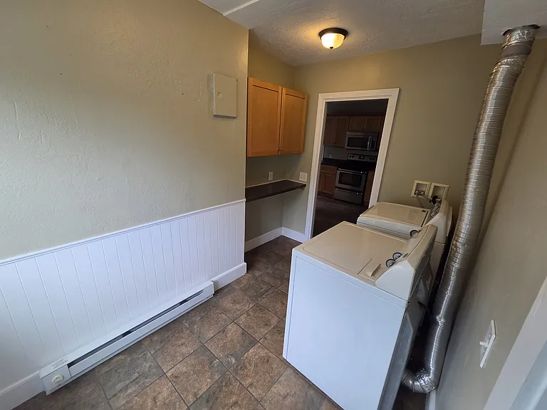 In-Unit laundry area with washer and dryer.