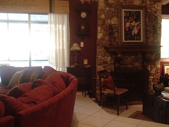 Stone firelplace in sunken sitting room