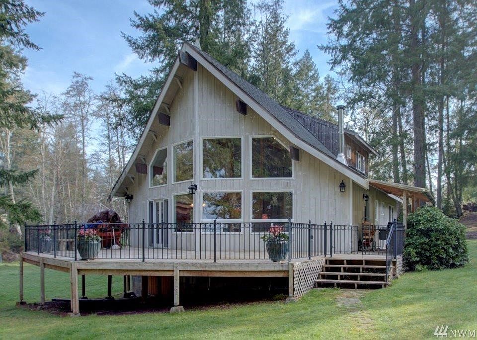 Private Herron Island with Private Ferry. This spectacular home was built in 1993 with soaring front windows that gives a lot of