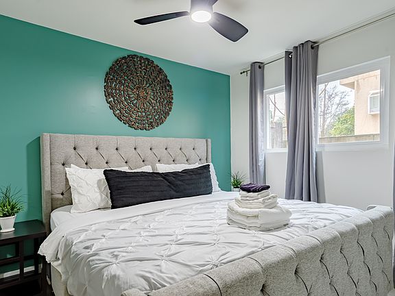 Rest easy in the tranquil and spacious bedroom, featuring a comfortable bed with soft linens, and your own personal TV for ultimate relaxation.
