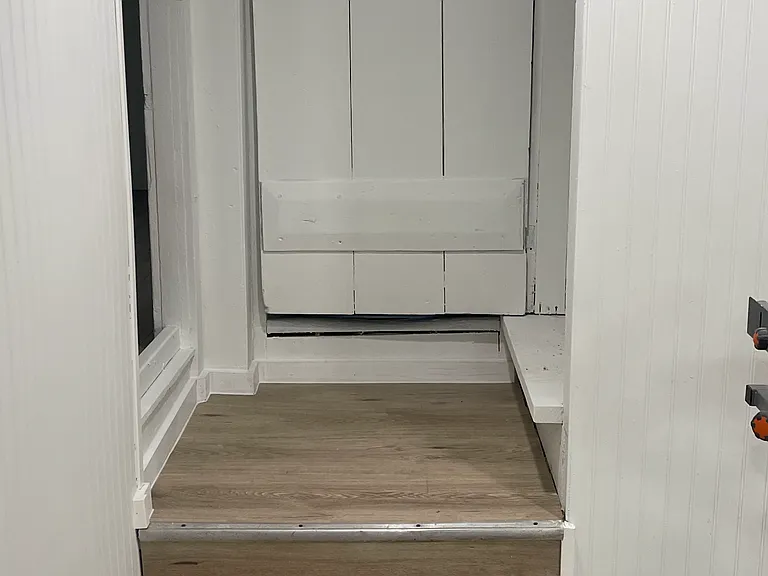 Master bedroom entrance doorways off the kitchen , steps on right to enter upstairs bedrooms