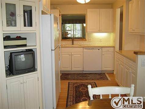 Very practical kitchen work area with gas stove.