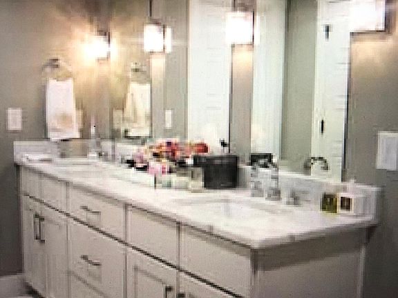 Master Bathroom white marble vanity.