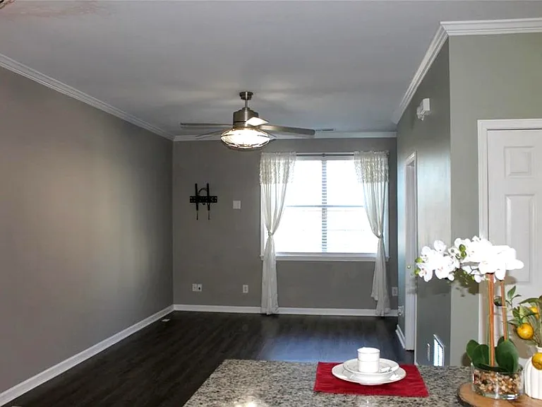 Kitchen-to-living open layout with designated TV mount for connected, functional living.