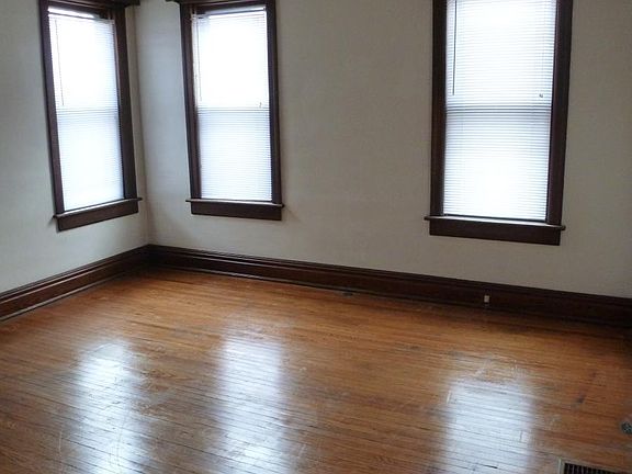 Spacious Bed Room Includes Blinds and Beautiful Hardwood Flo