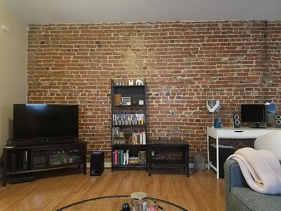 Living room, exposed brick.