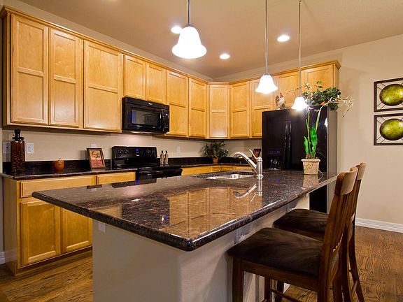 Kitchen with Granite Island and Counters