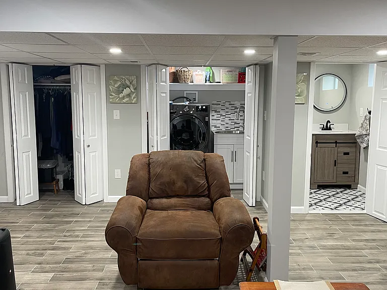 Basement Living Room/Movie Room with another walk-in closet. Laundry room & half bath.