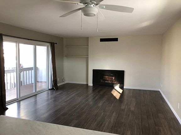 Bright living room with fireplace.