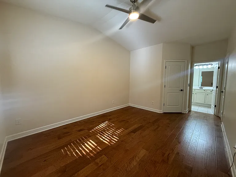 Master bedroom with vaulted ceiling