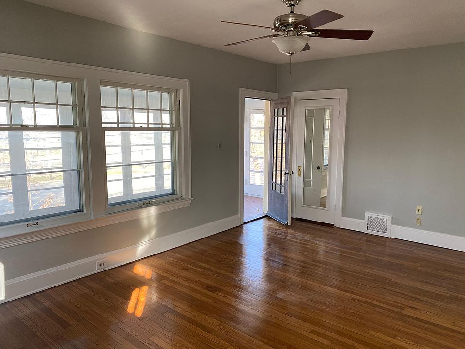 Front door to porch and large closet with mirrored door.