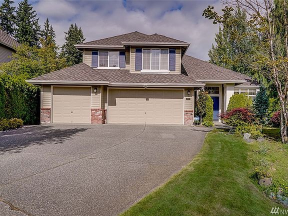 South-facing home. Nicely manicured yard, long flat driveway. 