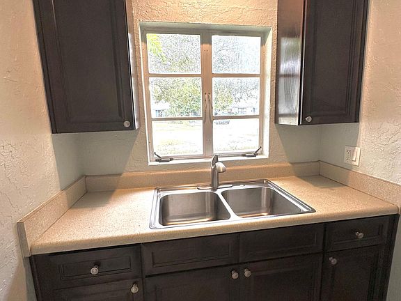 Deep sink with pull out faucet for easy cleanup.