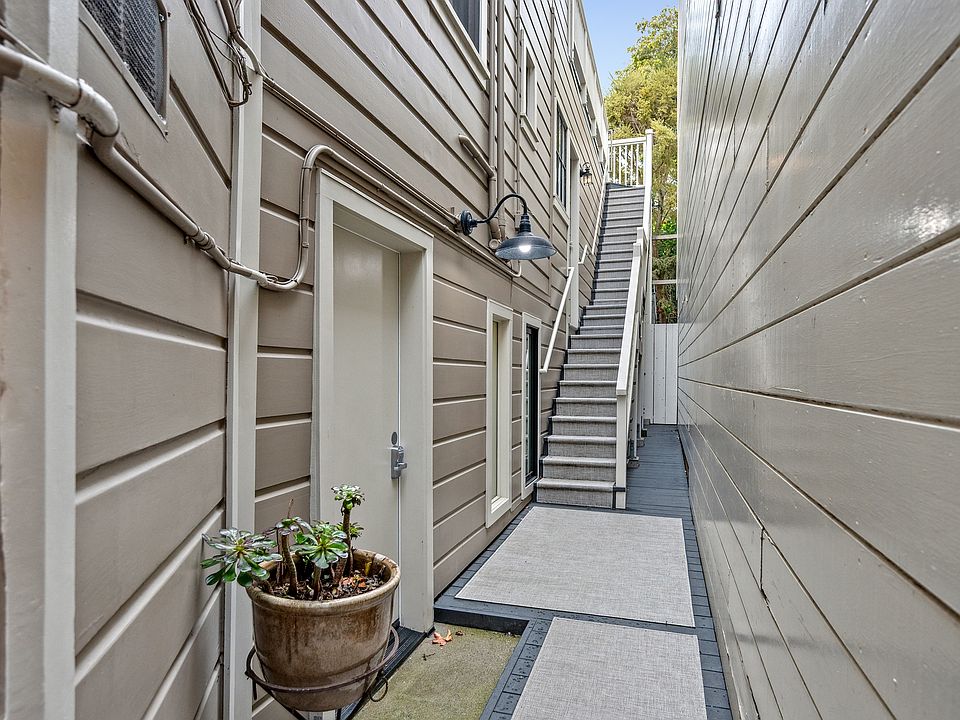 There is a downstairs door to the bedroom level, and up the stairs to front door to living level