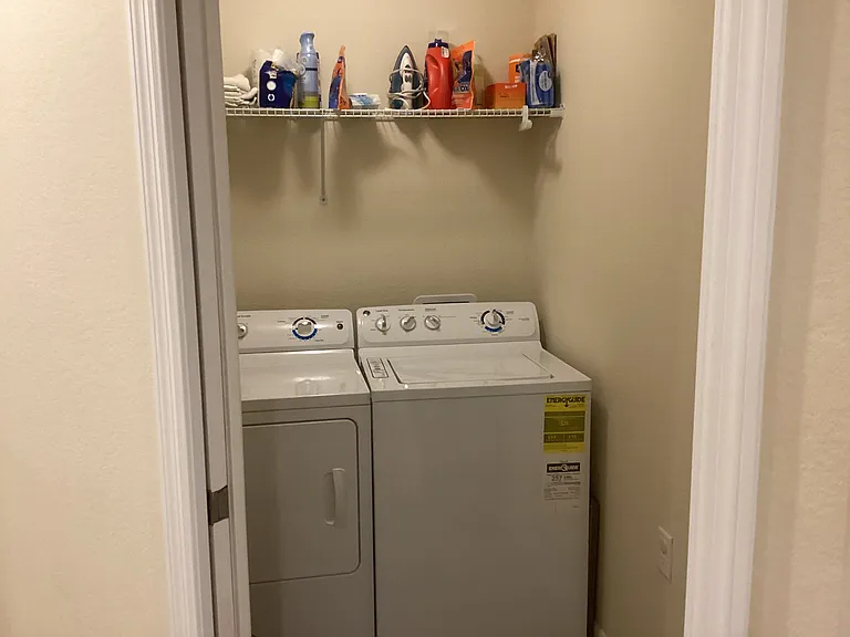 Laundry in unit with full-size ironing board