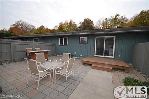 HUGE paved, private patio with wood deck.