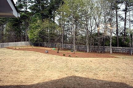 Huge level lot that backs up to woods and is fenced for extra privacy.