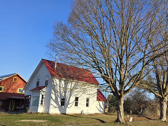 This light filled home sits on a corner lot next to owners' home