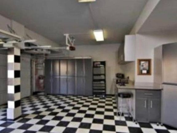 3 car garage with custom storage cabinets