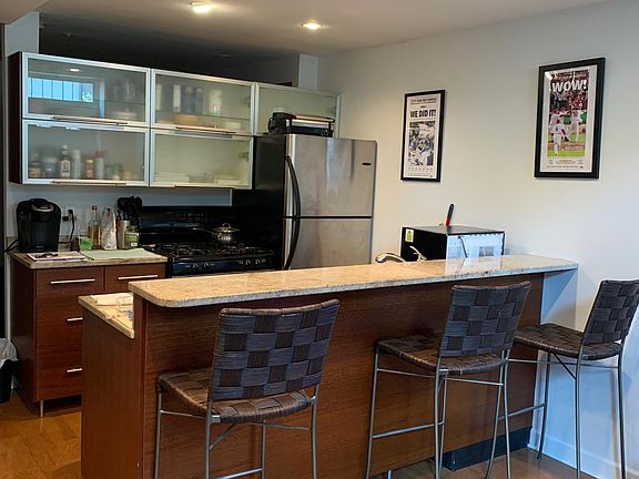 Bar stools come with the unit, if you wish. Stainless steel appliances, gas oven,dishwasher, disposal.