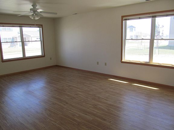 Open living room with wood plank flooring