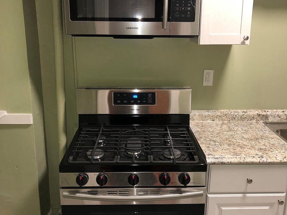 kitchen with brand new stainless steel 5 burner stove