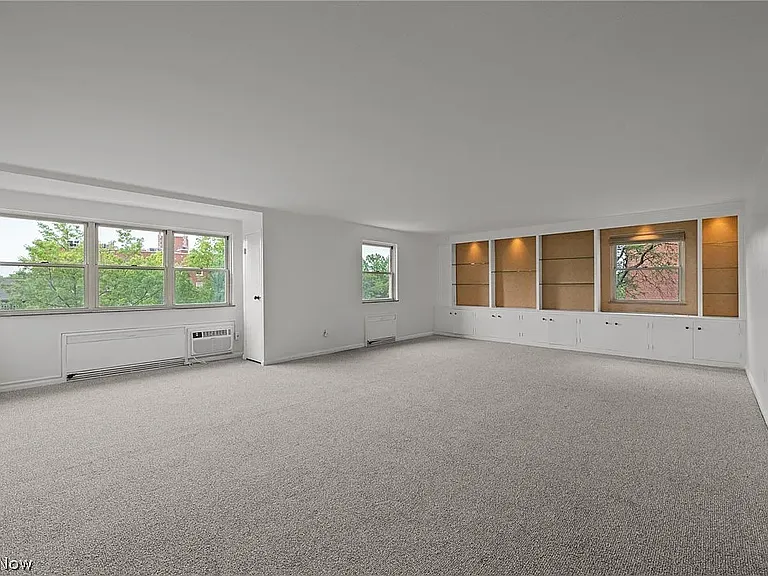 Spacious living room with window views facing Shaker Blvd.