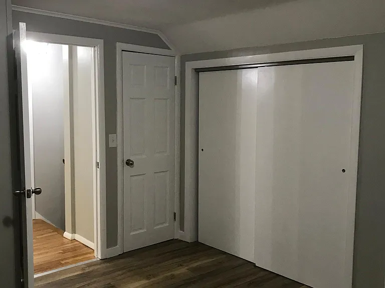 Primary bedroom cedar closet (left) & large closet