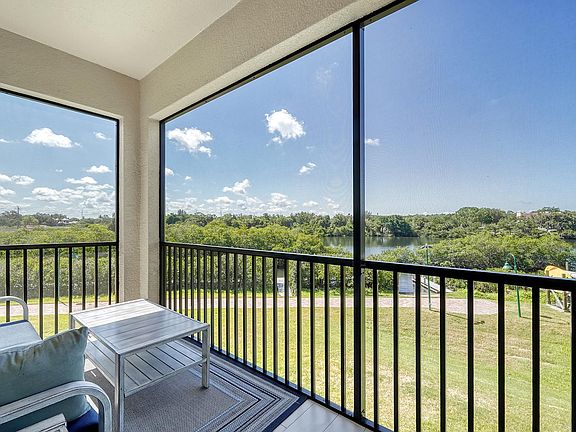 Main level Lanai view looks right onto the creek and at the Phillippi creek park across the creek.