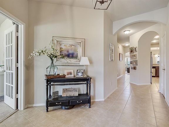 The photo was taken during prior occupancy. All furniture, decor, and personal items shown are for staging/illustrative purposes only and are not included with the home.