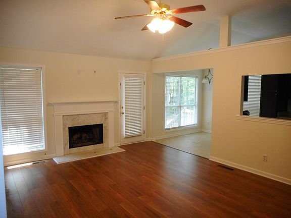 Large lounge with fireplace, new laminate flooring and fresh