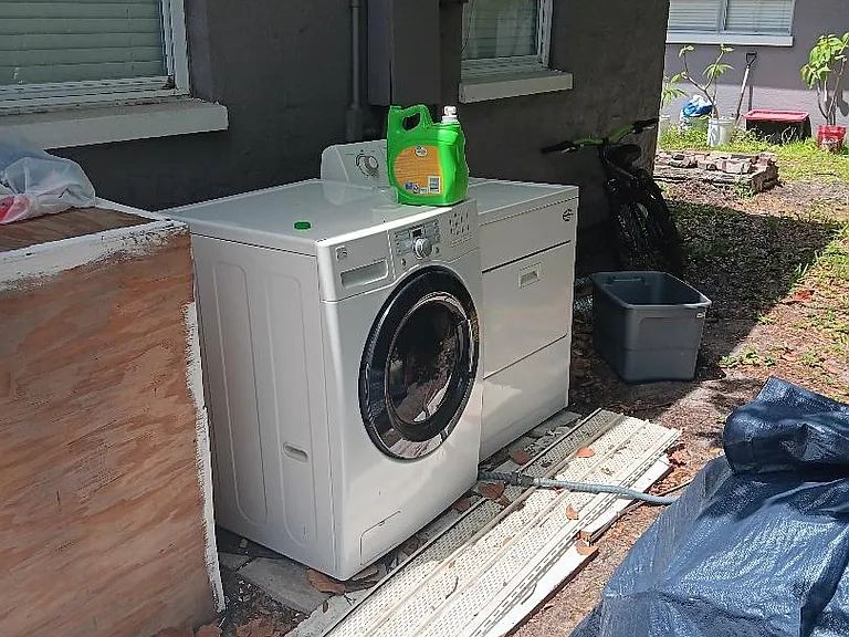 washer dryer located behind unit