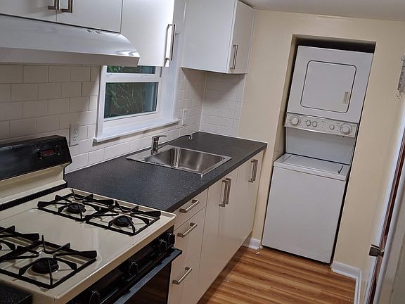 Galley Kitchen with washer dryer. Gas stove. Efficient storage, under cabinet drawers.