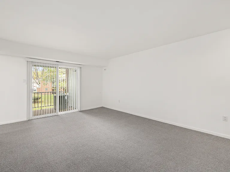 Spacious living room features sliding glass doors that lead to your private patio or balcony (1-bedroom floor plan shown)