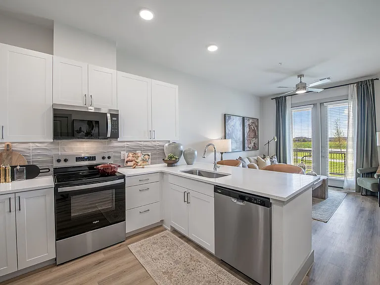 Step into modern living at Sage at Celina Residences. This stylish kitchen features sleek appliances, ample counter space, and natural light, perfect for culinary enthusiasts. Don't miss out on your ideal homeschedule a tour today!