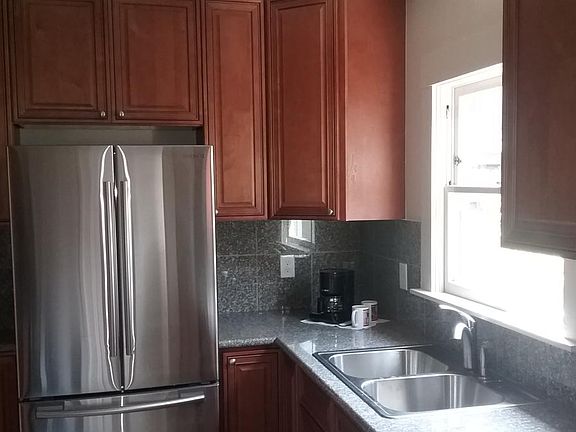 Convenient open kitchen with new cabinets, counters and appliances