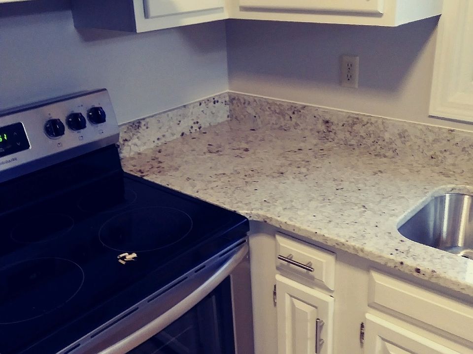 Kitchen cabinets and granite countertops.